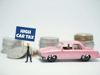 Mini toy of action figure and car at table with blurred background. Miniature diorama photography...