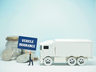 Mini toy of action figure and car at table with blurred background. Miniature diorama photography...