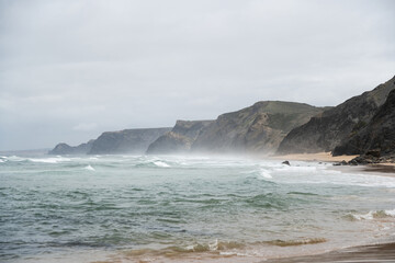 Tempestuous Waves Crash Against a Rugged Coastline