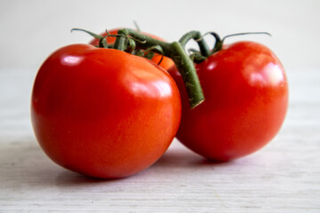 Tomatoes and Cherry tomatoes on a white wood texture table