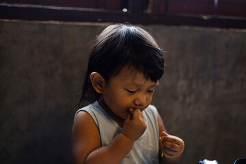 Toddler Is Eating Noodles With His Hands
