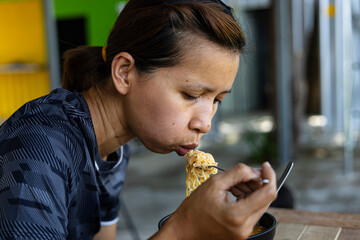 Woman Is Eating Instant Noodles, Tom Yum Kung Flavor