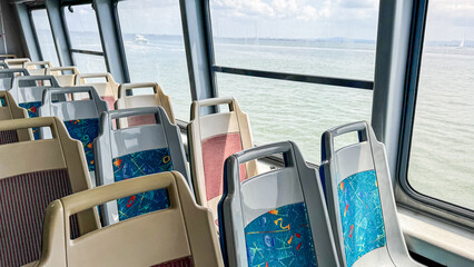 Empty ferry seats, maritime wanderlust on open waters, dreamlike journeys; celebrate Ocean Day,...