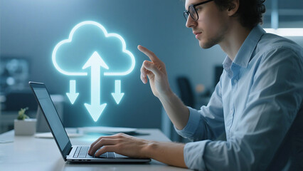 Man uses laptop with cloud computing graphic overlay for data