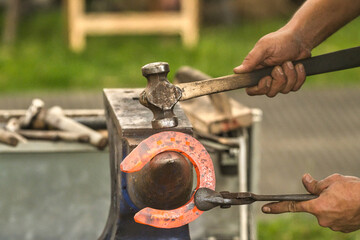 hammer hitting horseshoe