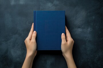 Pixel Perfect Image of Hands Placing a Book with Blue Cover