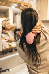 Woman Brushing Hair