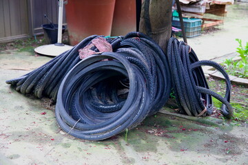Stack of Used Bicycle Tires at Neungnae Repair Station