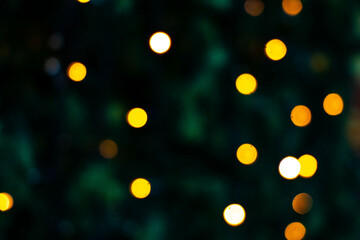 Blurred defocus christmas background. Blurred dark background with Christmas tree.