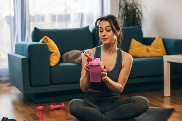 Woman Drinking Water After Workout