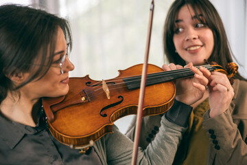 Music Teacher Assistance Her Student
