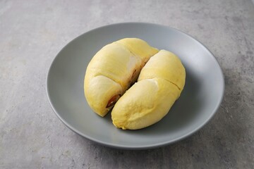 Fresh Durian in grey  plate on grey background