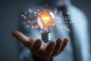 A glowing light bulb hovers above a businessman’s hand, symbolizing a moment of insight and innovation.