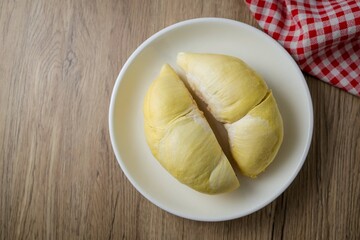 Fresh Durian on white plate , wooden background, , top view food table, fruit	