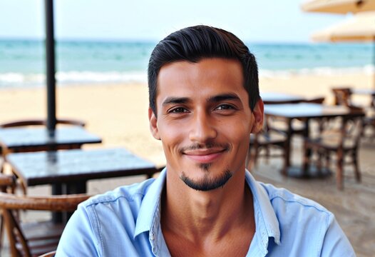 Portrait of a man sitting at an outdoor cafe near the seaside with copy space