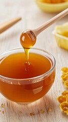 Golden Honey Drizzle Into Glass Bowl With Natural Wooden Dipper
