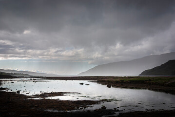 A gloomy, summer landscape HDR image of Little Loch Broom with distant rain approaching, near...