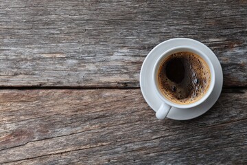 White coffee cup on wooden table