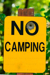 No Camping sign, in rural northern Wisconsin, once used for target practice