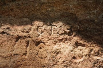 Pioneer carving in sandstone outcropping within Roche-a-Cri State Park, Adams-Friendship, Wisconsin