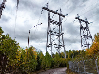 Krasnoyarsk Hydroelectric Power Station infrastructure under cloudy skies in autumn landscape