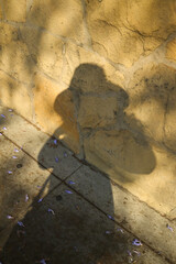Human Silhouette Shadow  on Sidewalk
