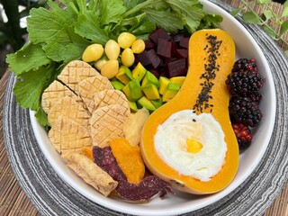 Baked tofu and Soft boiled egg in butterscotch with mixed salad on top with sesame dressing