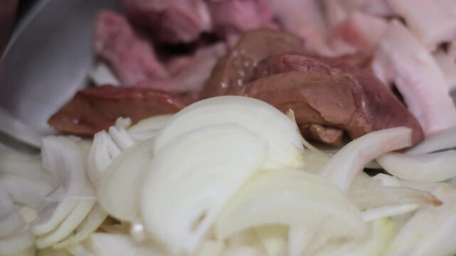 Slicing raw meat on a wooden cutting board in the kitchen. Raw beef meat, cooking process, stock video footage 4k.