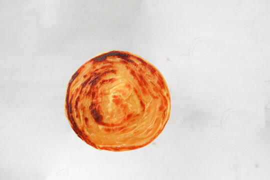 paratha bread or canai bread or roti maryam, favorite breakfast dish. on white background