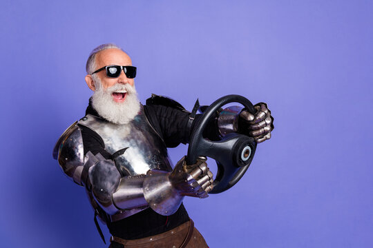 Knight in shining armor holding steering wheel with modern sunglasses and cheerful expression against vibrant purple background