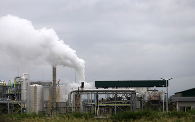 
Factory generating industrial pollution by emitting smoke and smog