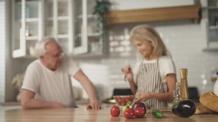 Low-calories diet in old age for stay healthy, woman cooking salad for old man. Careful wife and husband in cozy home kitchen, calm morning in weekend, aged spouses spending pastime together, portrait - Powered by Adobe