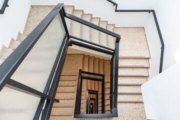 Empty Spiral Square Stone Staircase in a European Residential Building