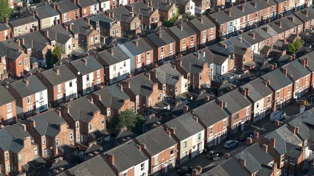Aerial rooftops of terraced houses on a large social housing estate