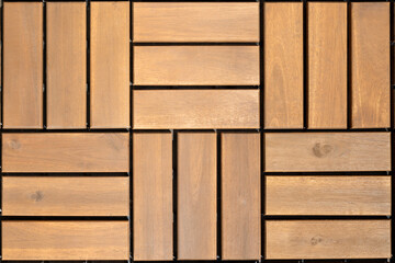 Click lock deck tiles for patio, balcony or deck. Flat lay of outdoor floor tilling in basketweave...