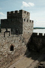 Medieval stone walls and ruins of Ram Fortress under a bright sky in Serbia. A popular tourist destination
