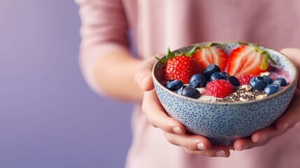 Berry smoothie bowl with chia seeds on a pastel lavender background under soft morning light