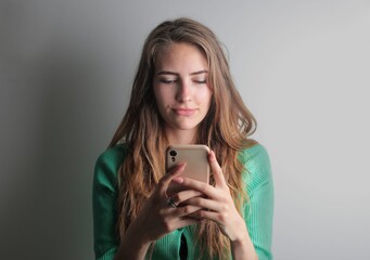young woman uses  a smartphone