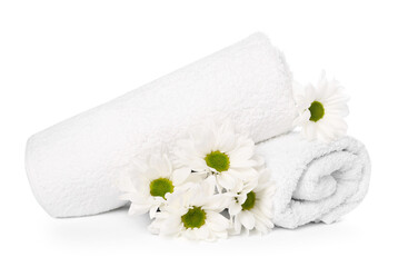 Soft towels and chrysanthemum flowers isolated on white