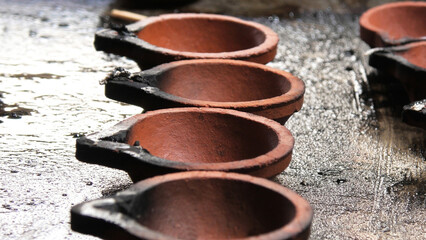 Traditional Indian clay lamps with lights extinguished