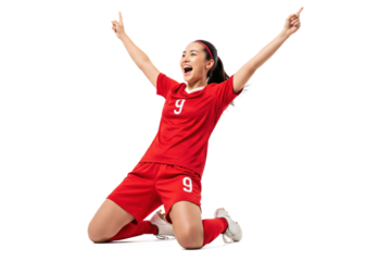 Happy female soccer player celebrating goal in red uniform