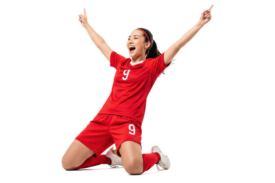Happy female soccer player celebrating goal in red uniform