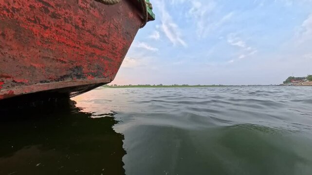 Boat ride in yamuna river at sunset