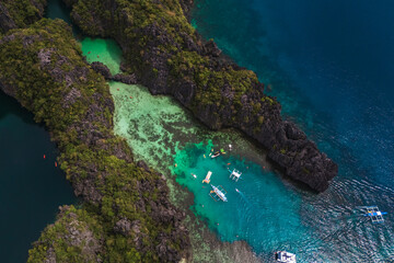 Bird's eye top View of the Big Lagoon and Limestone Islets of Minoloc Island, Surrounded by Turquoise Waters in El Nido, Palawan, Philippines