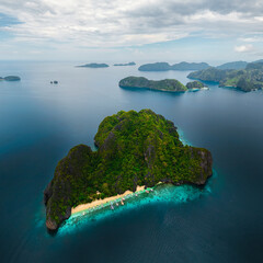 Wide Scenic Aerial Panorama of Bangka Boats Docked in Entalula Island’s Limestone Cliffs and Surrounding Islets in El Nido, Palawan, Philippines