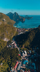 Aerial shot of El Nido town with islands in a Tranquil Sunset Over Corong Corong Beach, El Nido, Palawan,  Philippines.