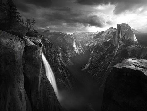 A dramatic view of Yosemite Falls under a stormy sky. The mist from the waterfall blends with the surrounding fog, adding to the moody atmosphere. - Powered by Adobe