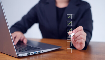 Businesswoman mark checkboxes, Survey form, check marks on checklist,Checklist concept.