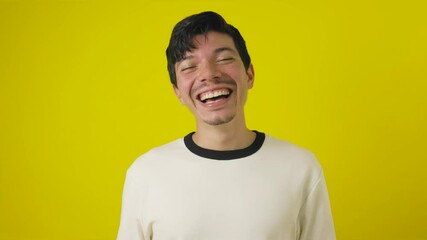 Young freckled man with a mustache in a good mood smiling on a yellow background with copyspace, happy young man concept