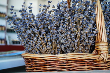 Dried lavender bouquet in a woven basket. Rustic floral arrangement for home decor, aromatherapy,...